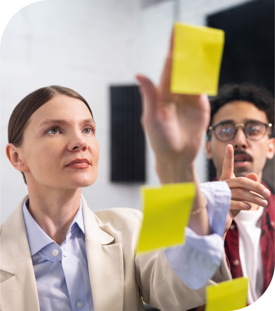 medium-shot-colleagues-sticking-post-its